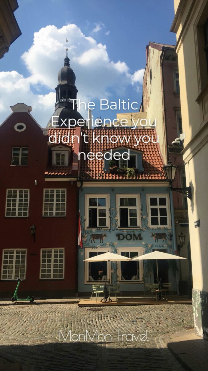 Colorful Baltic old town buildings and church tower