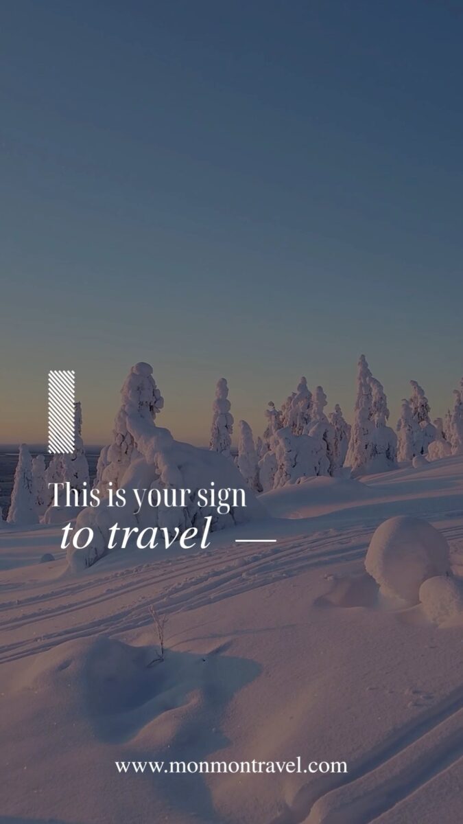 Snow-covered trees at sunset with travel quote