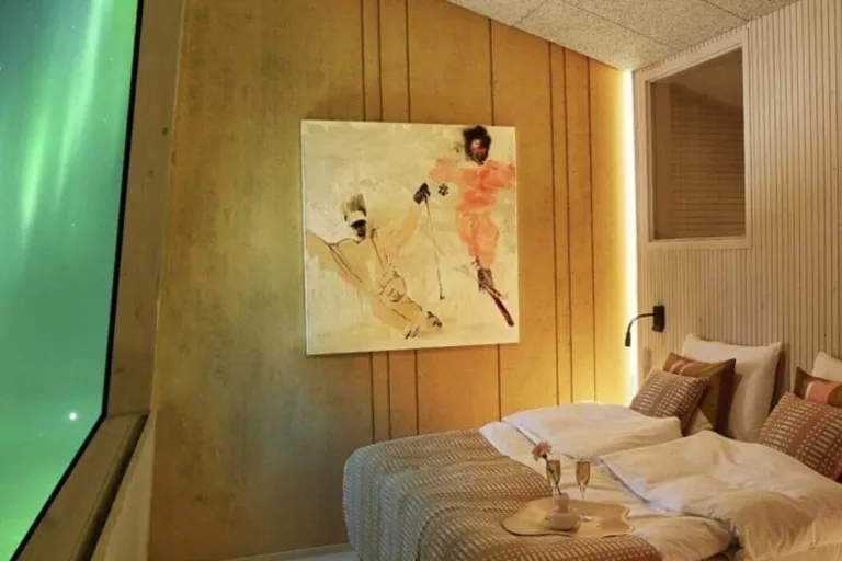 Modern bedroom with abstract art and champagne tray