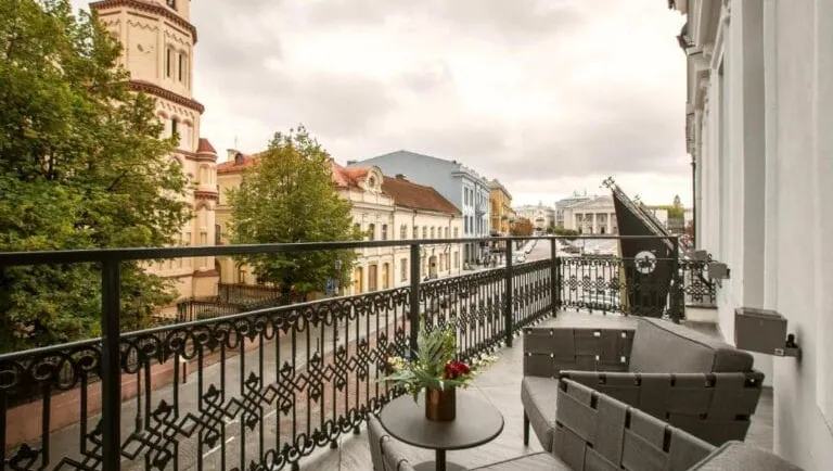 Balcony with wrought-iron railing overlooking historic street