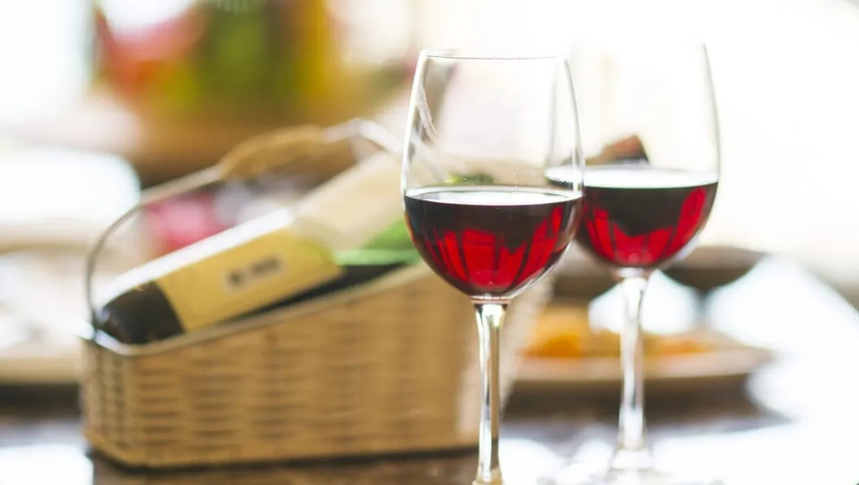 Two glasses of red wine on table