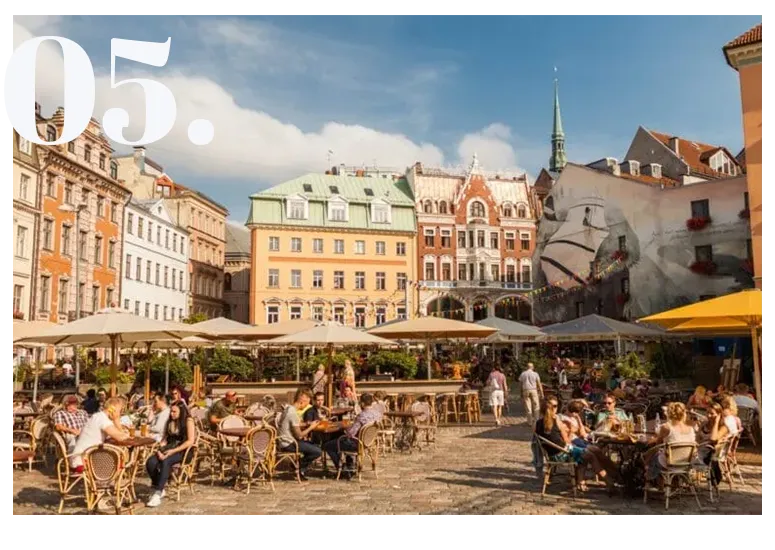 Crowded outdoor cafés in Riga’s Old Town square